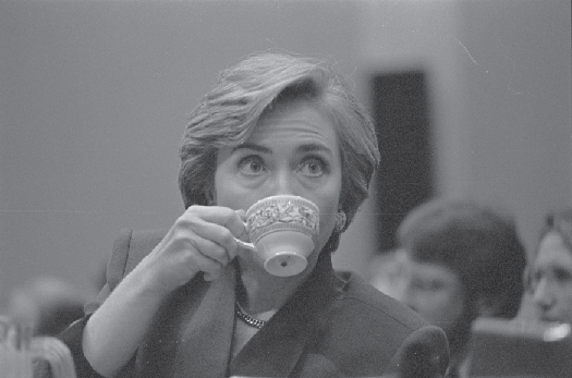 Black and white photo of Hillary Clinton drinking from a teacup 