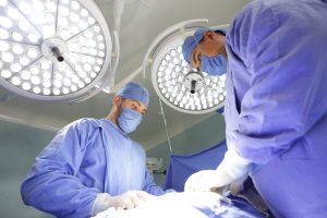 Two surgical assistants in the operating room.