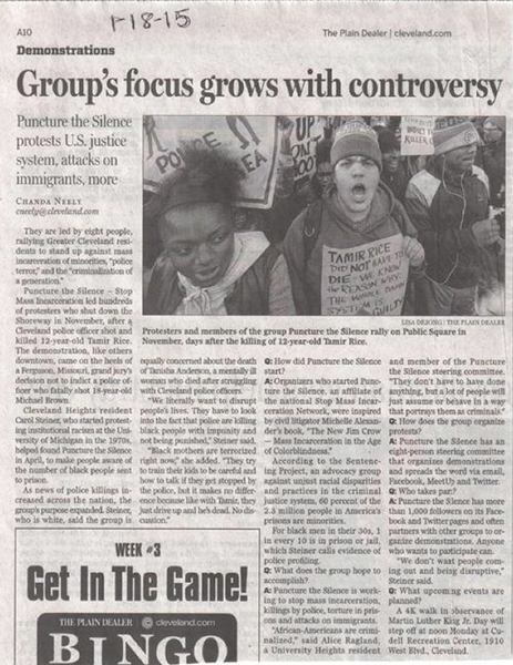 Newspaper clipping. Headline reads, “Group’s focus grows with controversy.” The subheading, “Puncture the Silence protests U.S. justice system, attacks on immigration, more.” Includes photo of several protesters. 