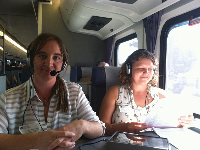 Ildi Carlisle-Cummins and Aubrey Thompson aboard an Amtrak train.