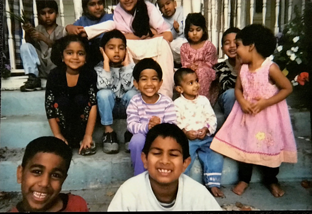 The writer, Abdul Syed is shown as a child in a group photo with numerous cousins, all children..