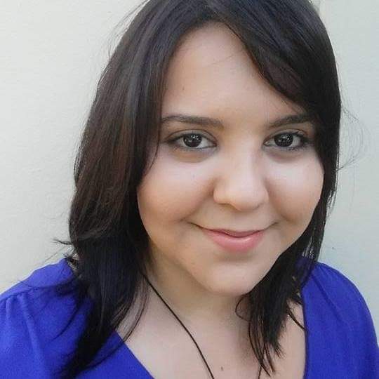 The writer, Amanda Lopez, a young Latina woman, is shown smiling.