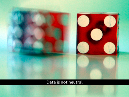 Blurry dice. Text: Data is not neutral