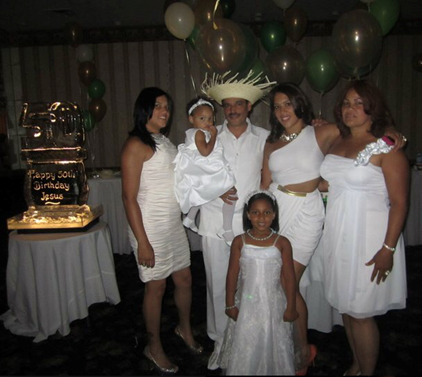 The writer, Raquel Torres is shown with her family at a celebratory event.