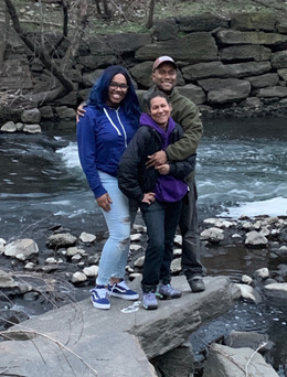 The writer, Omar Fajardo, is shown with his mother and cousin next to the Bronx River.