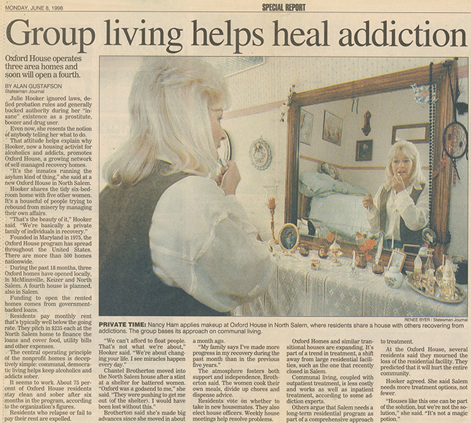 Two pages from a newspaper article, the first headline reads, “Alcohol Treatment Options Limited,” with a photo of Julie Hooker, hands clasped and eyes looking slightly sideways, reflectively. The second part of the article is headlined, “Group Living Helps Heal Addiction,” and features a large photo of a woman, Nancy Ham, putting makeup on in front of a mirror in her bedroom.