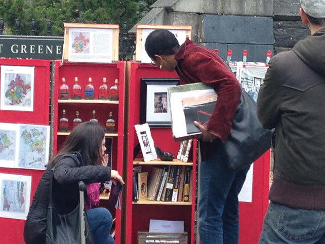 Pictured here is a close up of archival objects like shoes and antique photos of Black people who live(d) in the area.