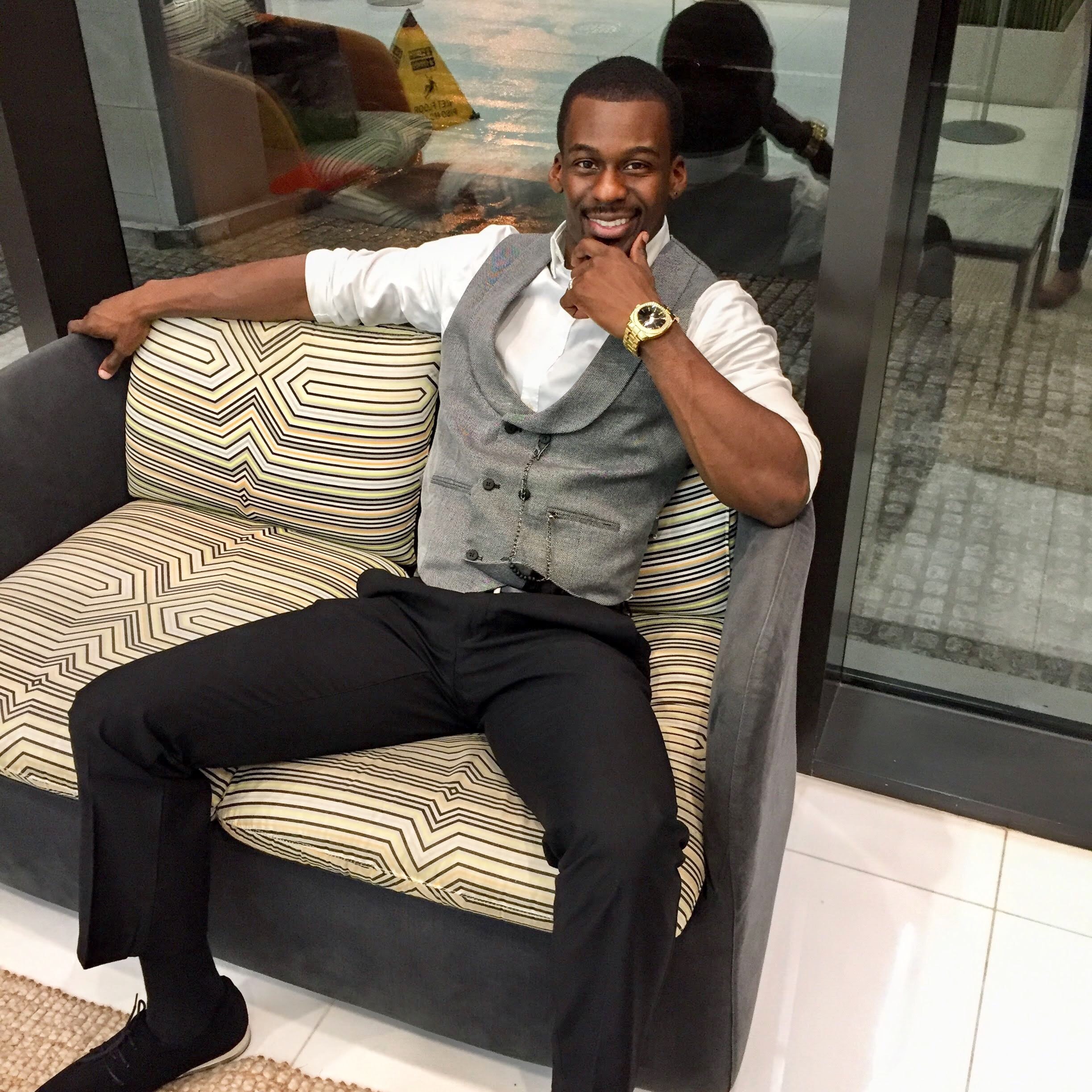 The writer, Monroe Anderson, is shown smiling, confidently seated and snappily dressed.