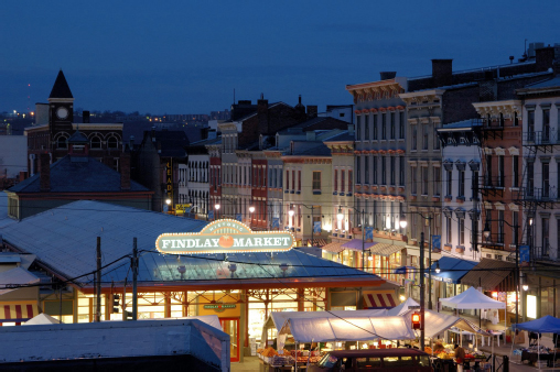 Aerial view of Findlay Market brightly lit at night.