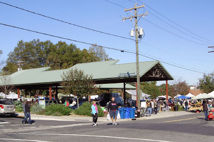 Outside view from corner of Foster and Hunt Streets. Cars and groups of people lined the streets in front of the pavilion.