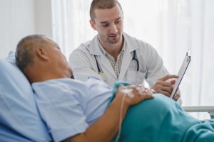 A health professional consults with a patient.