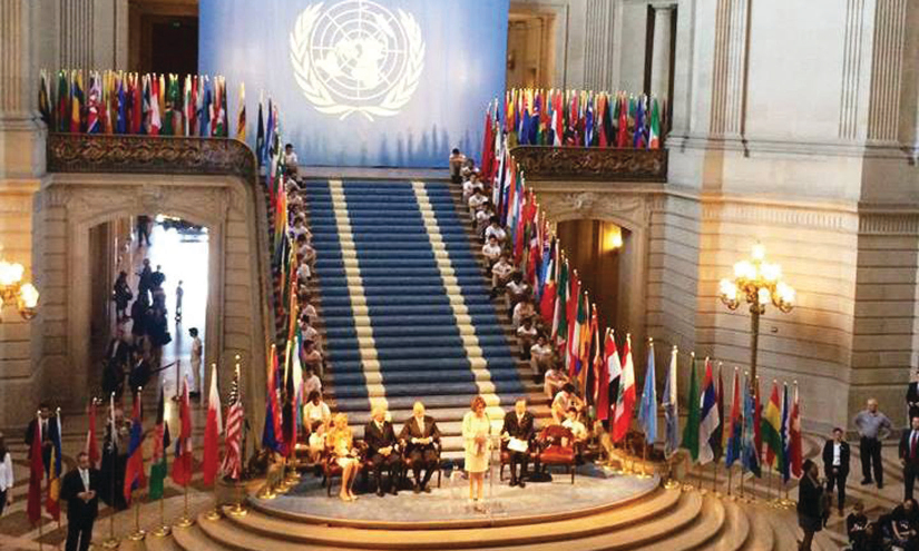 An image of Nancy Pelosi and several dignitaries at the United Nations Charter.