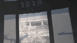 This is a .gif image. It spins clockwise from the inside of a room with exposed beams. There is a person in a gown, they dance salpuri-chum in a hanok