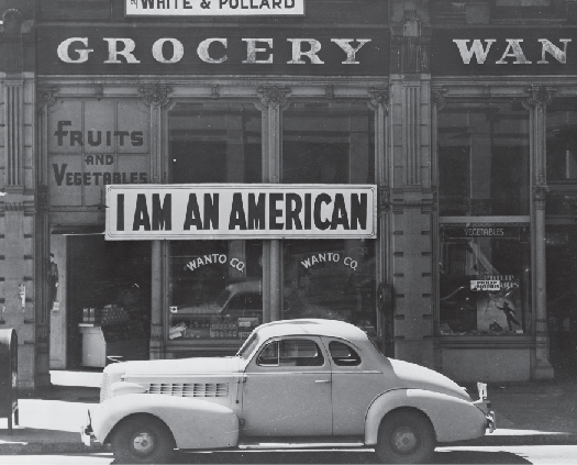 A photo of sign in a store front that says “I am an American.”generated with medium confidence