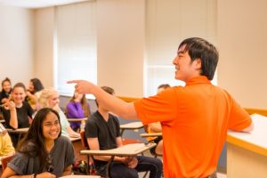 teacher speaking in front of class
