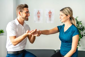 A physiologist consults with a patient.