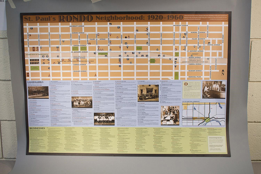Photograph of Gerlich’s poster of Rondo businesses and landmarks. The top half of the poster is a map with numbers demarcating important places. The bottom half of the poster is divided into businesses and landmarks.