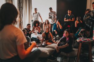 group of people watching someone talk
