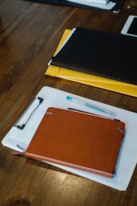 notepads and binders on a table