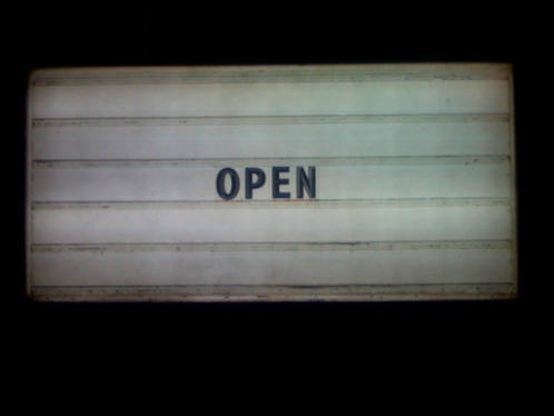 The word "open" on a sign