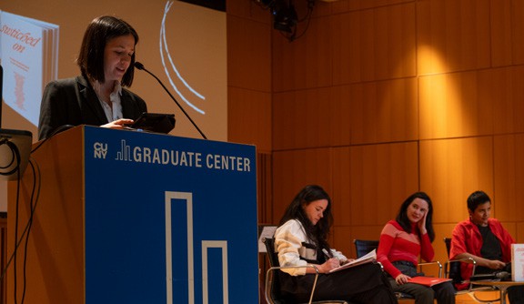 A person giving a speech at a podium
AI-generated content may be incorrect.
