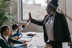 teacher high-fiving a student
