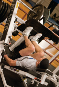 Photo of man doing leg presses