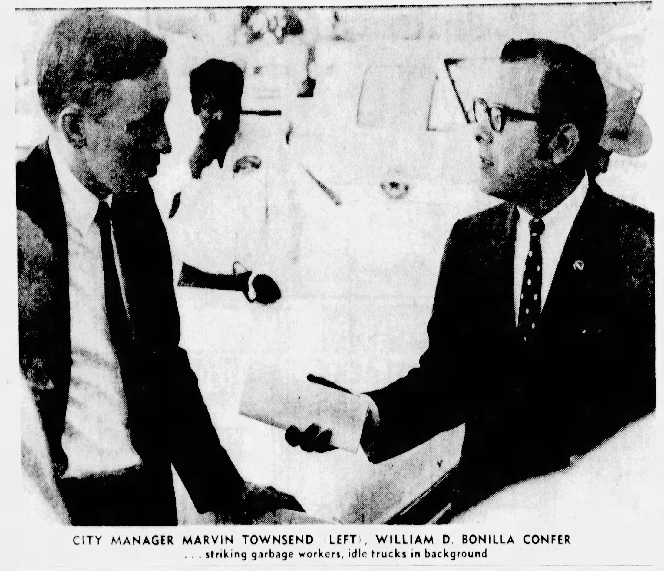 Newspaper clipping image of two men talking