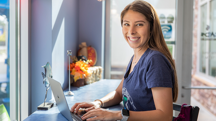 A picture of a student using a laptop.