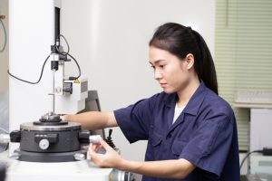 Engineer operating a piece of lab equipment.