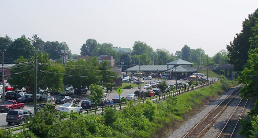 Outside view of pavilion. Lots of trees and other greenery surround it.