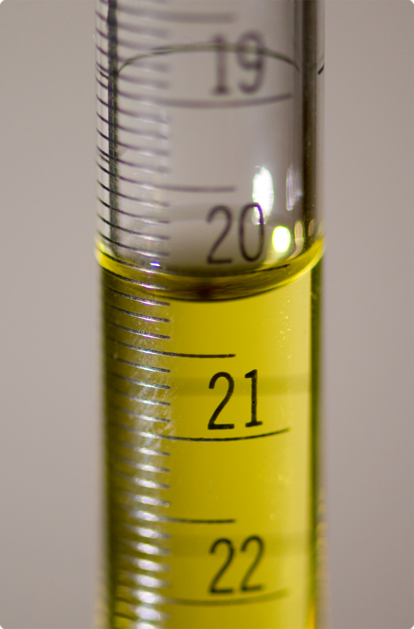 Close-up of a buret showing meniscus and markings.