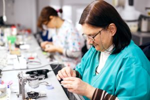 An orthotist working on a prosthesis.