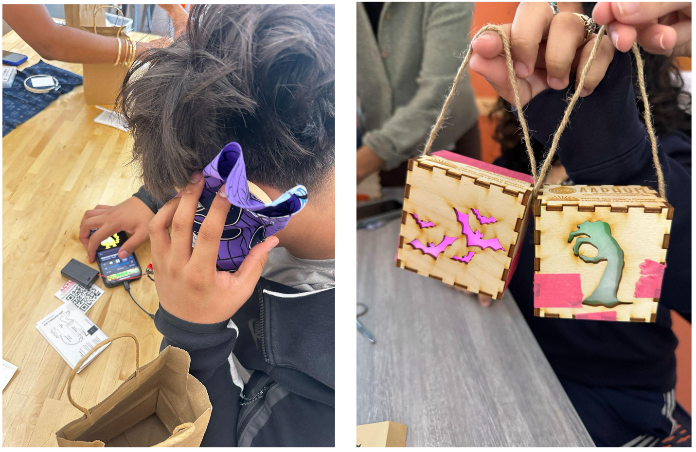 Left: a student holds an embroidery hoop connected to a circuit up to their ear. On the table, their phone is playing music. Right: two students’ hands holding up wooden boxes with spooky cut-outs on them. The left box has cut-out bats that glow purple; the right box has a cut-out hand that glows green. The boxes are held together with tape.