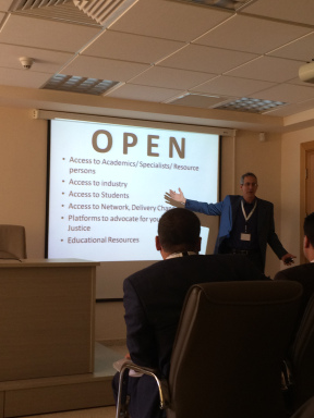 Marwan Tarazi giving a presentation about "Open"