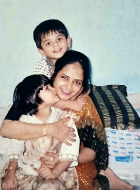 The writer, Nabeela Van, is shown as a child, seated with her late mother and brother. 