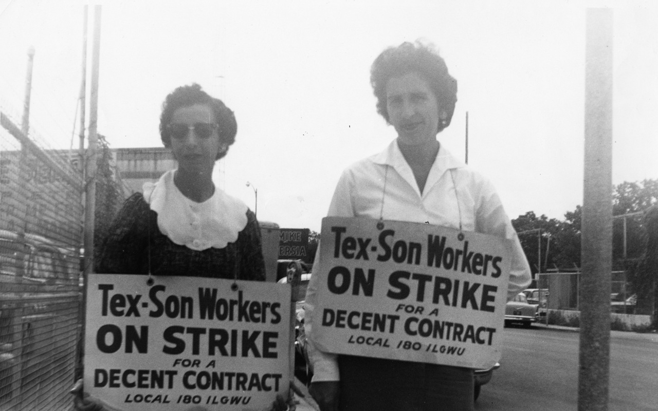 Two women with signs supporting the International Ladies' Garment Workers' Union, Local 180 (San Antonio, Texas) strike. (I. L. G. W. U.).